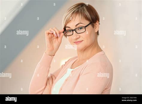 Portrait Of Mature Woman Wearing Glasses At Home Stock Photo Alamy