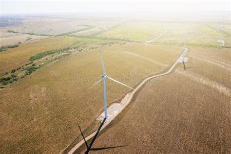 Wind Turbines In Green Fields Aerial View Alternative Electricity