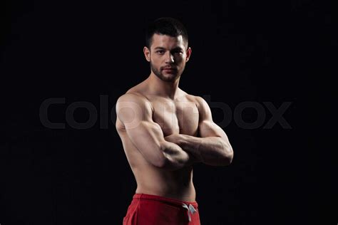 Handsome Bodybuilder Standing With Arms Folded Stock Image Colourbox