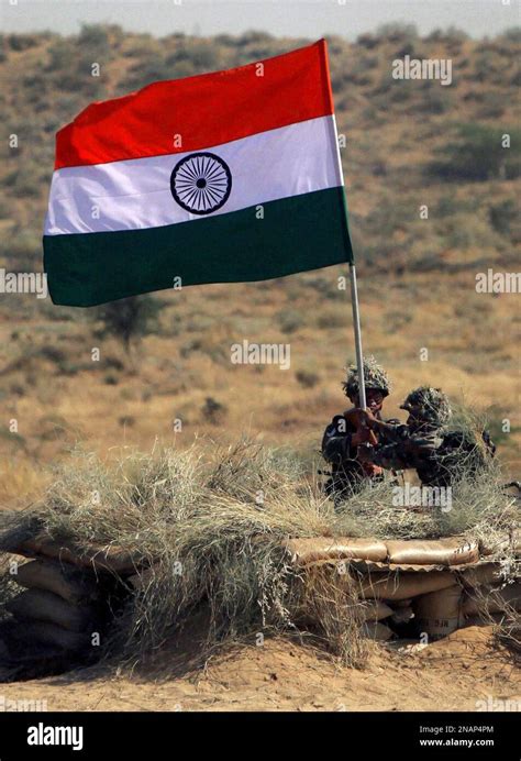 Indian army soldiers display the Indian flag during exercise "Sudarshan ...