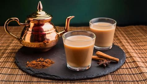 Faceted Glass Glasses On Wooden Table With Traditional Indian Drink Masala Chai Premium Ai