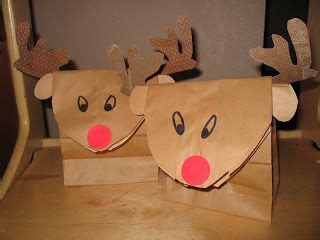 Two Brown Paper Bags With Reindeer Faces On Them