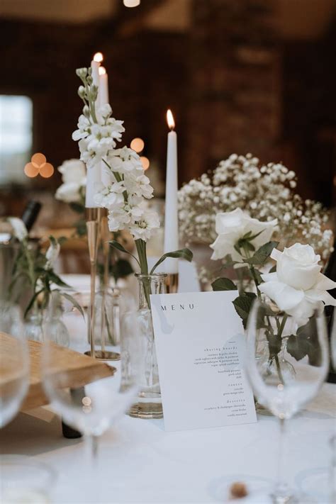 Bud Vases Full Of Beautiful All White Seasonal Flowers For This Wedding