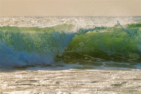 Breaking Ocean Wave on Sunset Stock Photo - Image of water, sunset ...