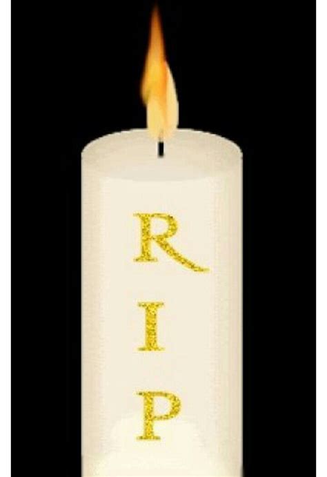 a lit candle with the word rip written on it