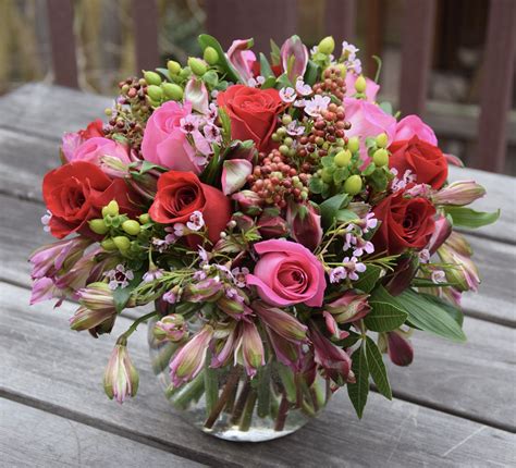 Flower Arrangement In A Glass Sphere With Alstroemeria Roses