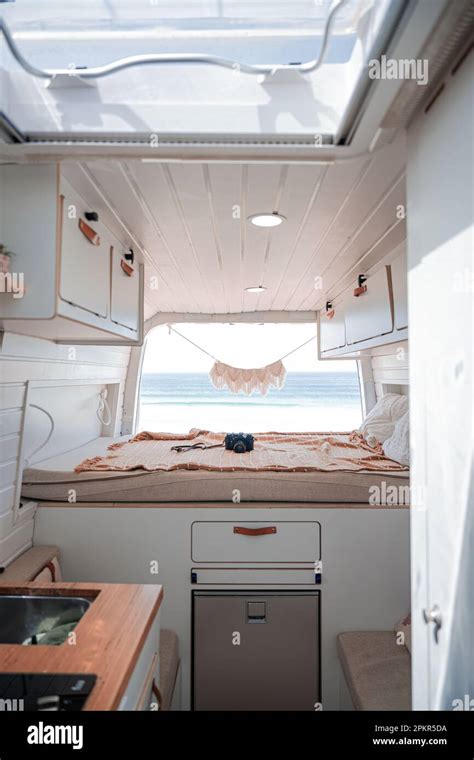 Stunning view of the interior of a van parked on a beach with the ocean ...