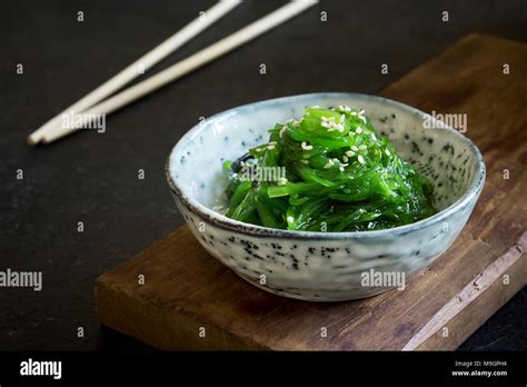 Chuka Seaweed Salad In Ceramic Bowl Over Black Background Copy Space