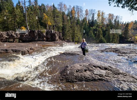 Cute Woman Tourist Takes Photos By Standing In The Middle Of The