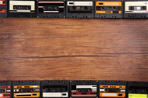 Premium Photo Group Of Audio Cassettes On Wooden Table Copy Space