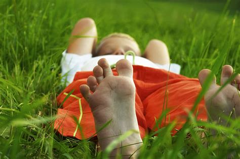 Barefoot Little Girl Laying Grass | Images and Photos finder