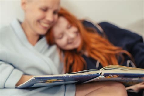 Premium Photo Happy Lesbian Couple Are Reading A Book Together