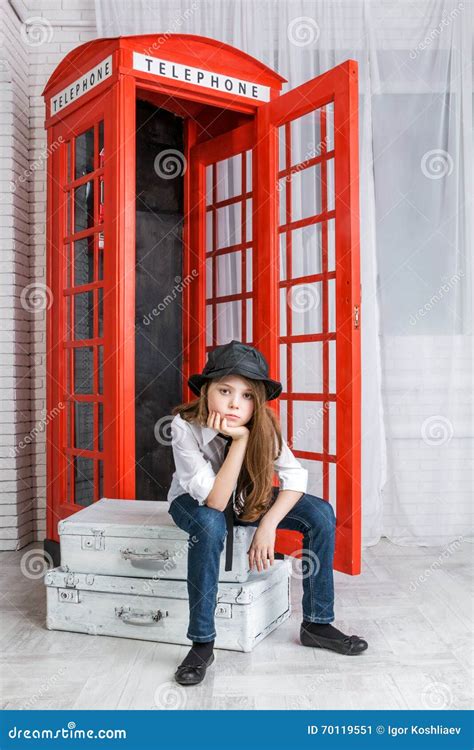 Girl Sitting On A Suitcase Near The Phone Booth Stock Image Image Of Expect People 70119551