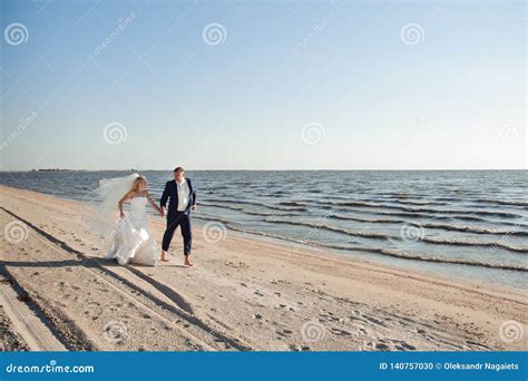 Couple in Love on the Beach on Their Wedding Day Stock Photo - Image of ...