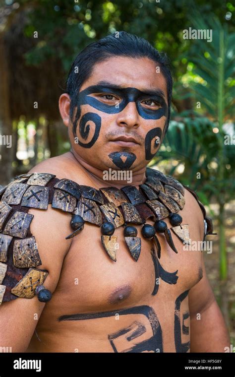 Local Mayan Male Dressed In The Traditional Face Paint And Body