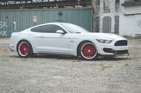 Striking Contrast: Custom Red Vossen Wheels on White Ford Mustang — CARiD.com Gallery