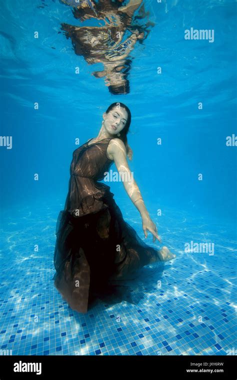 Woman in dress underwater hi-res stock photography and images - Alamy