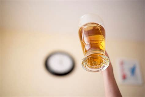 Premium Photo Close Up Of Hand Holding Glass Of Beer