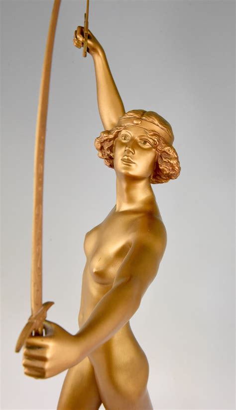 Art Deco Gilt Bronze Sculpture Of A Nude With Two Swords Deconamic