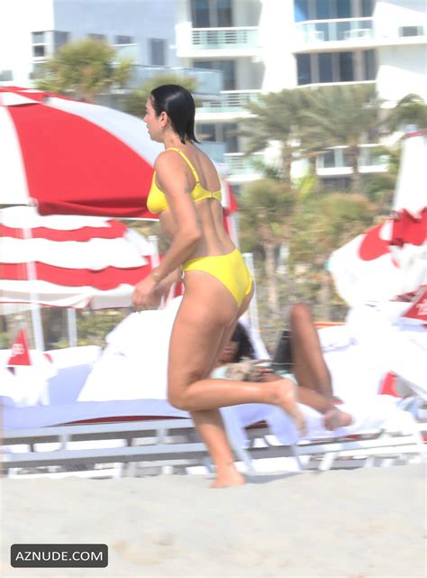 Dua Lipa Sexy In Yellow Bikini As She Takes Dip In The Ocean With Her SisterRina In Miami AZNude