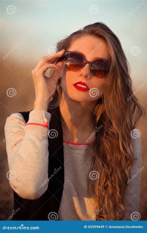 Striking Stunning Dazzling Staggering Exquisite Attractive Beautiful Girl Held Modern Sunglasses