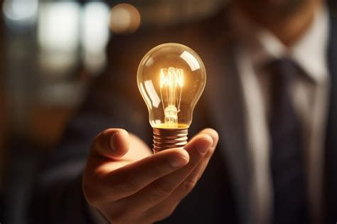 Premium Photo Inspirational Thoughts Human Hand Holds A Light Bulb