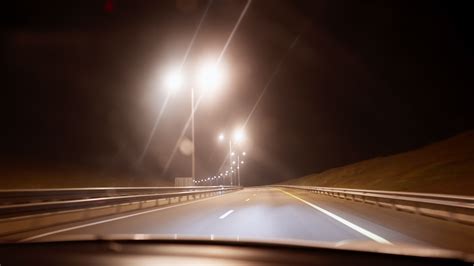 Inside View Of The Windshield Of A Car That Is Driving Along The