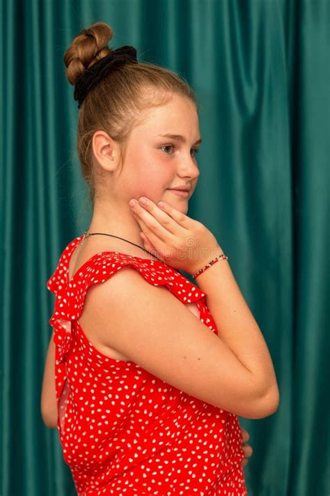 Teenage Girl Sitting On A Chair In A Red Suit Stock Image Image Of Blonde Cute 260555771