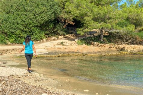 Latina Sportswoman Walking Along The Shore Of A Mediterranean Island Beach Stock Image Image