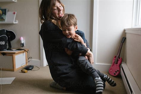 Mom And Son Enjoy A Cuddle Together At Home By Stocksy Contributor