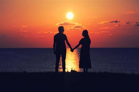 Two people holding hands at sunset 1864710 Stock Photo at Vecteezy