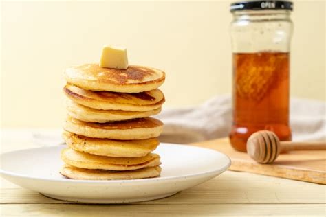 Premium Photo Pancakes With Butter And Honey