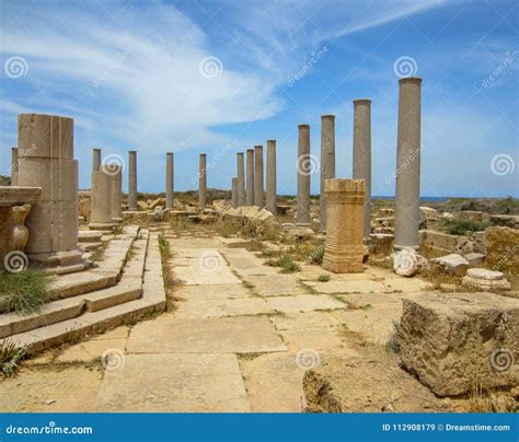 Columns Against Blue Sky At Ancient Roman Ruins Of Leptis Magna On The