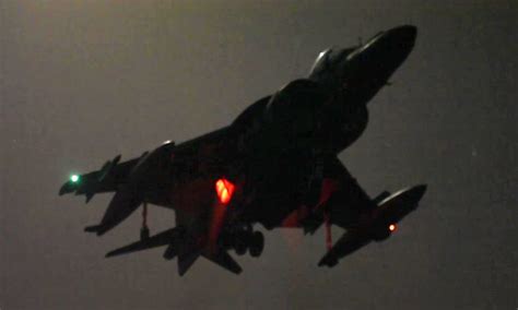 Harrier Jet Vertical Landing At Night On Amphibious Assault Ship ...