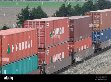 Hyundai Intermodal Freight Containers On Bnsf Freight Train At