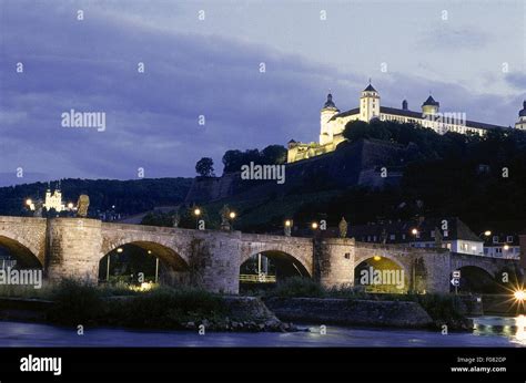 View Of Old Main Bridge And Marienberg Fortress At Night In Wurzburg