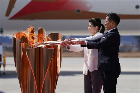 Tokyo Games relay opens in 100 days with 10,000 torchbearers questions