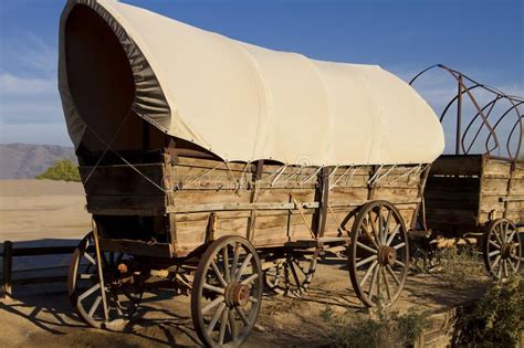 Old West Covered Wagon Train. Historic old Western covered wagons form ...