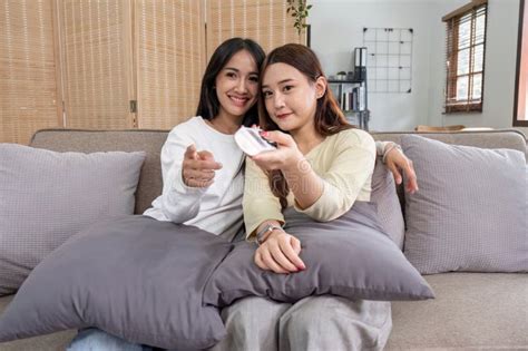 Asian Lesbian Woman Couple Enjoy Watch TV Together In House At Holiday Stock Image Image Of