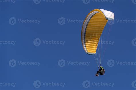 paragliding hang glider in the blue sky 17454263 Stock Photo at Vecteezy