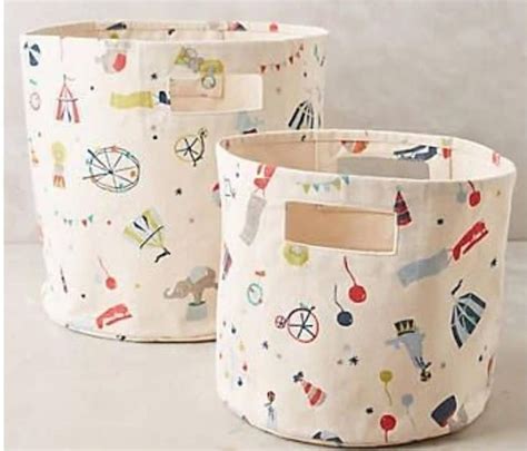 Two Storage Baskets With Different Designs On Them