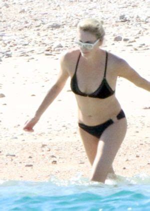 Charlize Theron In Black Bikini On The Beach In Los Cabos The