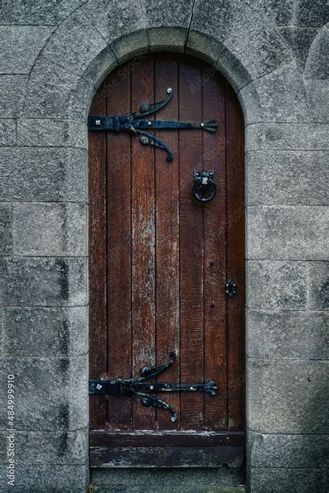 Vintage Old Wooden Door In Celtic Or Gothic Style With Iron Hinge And