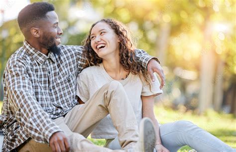 Happy Relax And Interracial Couple At A Park For A Date Quality Time And Bonding In Australia