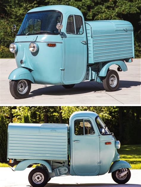 An Old Blue Truck Is Parked On The Street