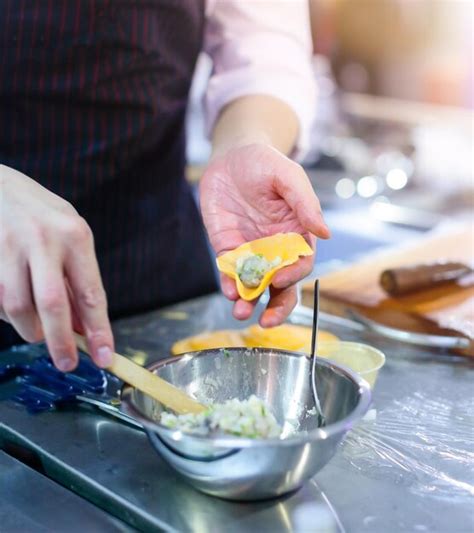 Premium Photo Midsection Of Man Preparing Food On Table