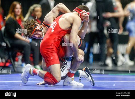 Oklahoma States Daton Fix Left Scrambles With Cornells Vito Arujau