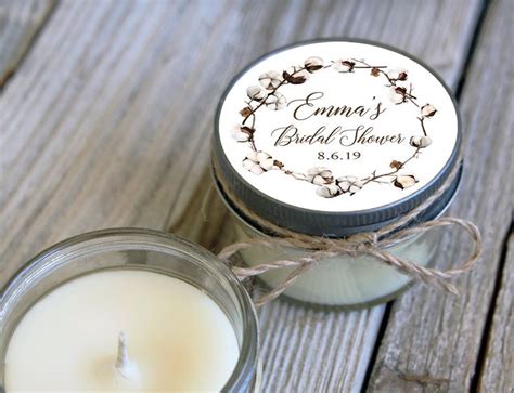 A Small Jar With A Candle Inside On A Wooden Table