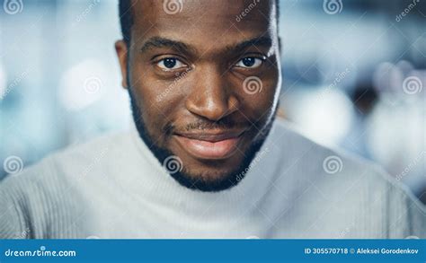 Close Up Portrait Of Handsome Black Man With Deep Brown Eyes Trimmed