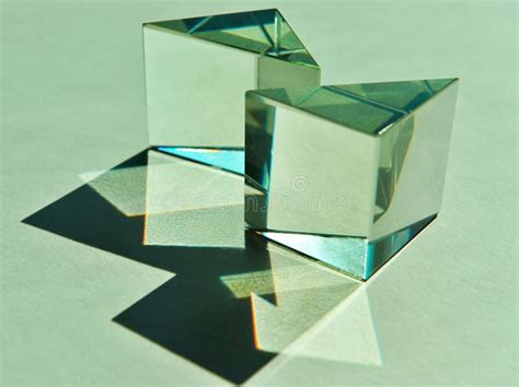 Two Triangular Glass Cube Prisms Refract Natural Light Into Shade And